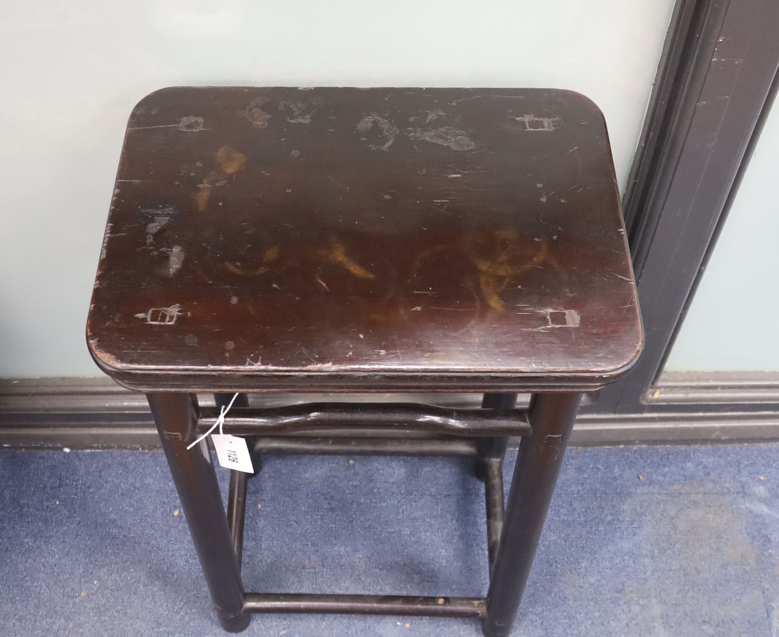 A Chinese rectangular lacquered stool, length 45cm, depth 31cm, height 73cm